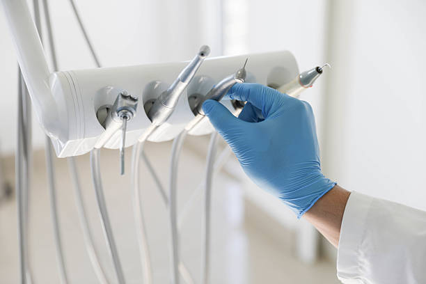 Professional Tooth Extraction technician working in South St. Paul, MN